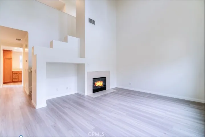 Stunning 2 Story ceiling Living Room with Fireplace