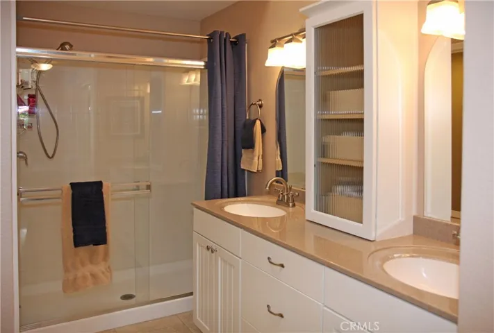 Master Bath with Upgraded Sinks and Vanity, Walk-in Shower, Bead-Board Cabinets, Designer Lighting Fixtures