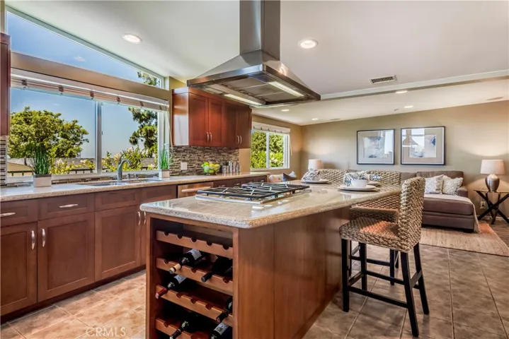 Gourmet kitchen with center island and stainless steel appliances