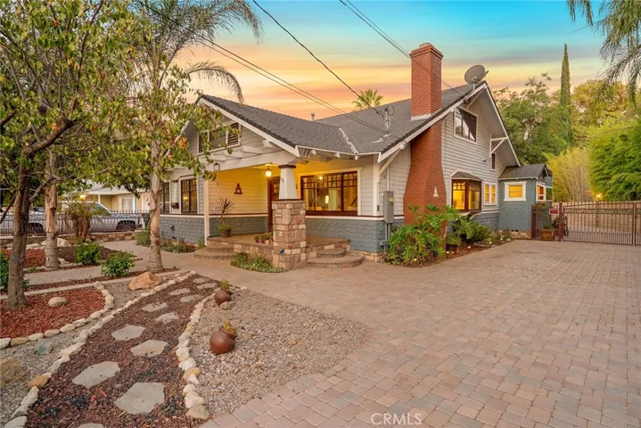 5732 Grand Avenue, Riverside CA 92504 set behind electric gated driveway with extensive pavers. This special home was moved here from Hollywood in the 1940s!