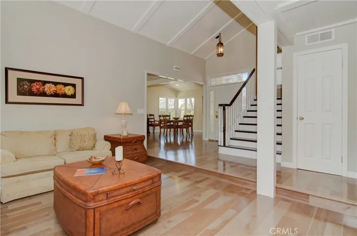 High quality hardwood flooring in most areas of the main floor and upstairs hall, plus wood treads and rail on custom staircase.