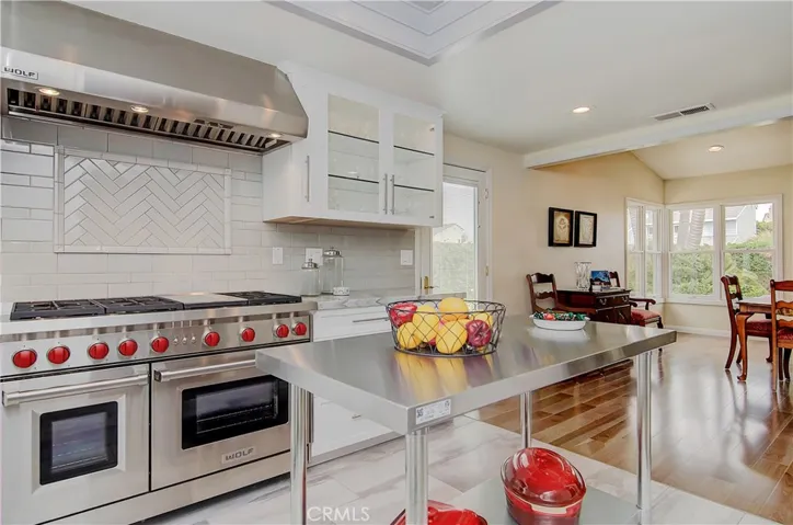 Amazing kitchen has ALL the bells and whistles...translated...high, high end appliances, fixtures and cabinetry and more!