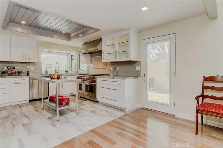 Kitchen opens to huge dining space, plus has French door to BBQ area...now that is convenient...