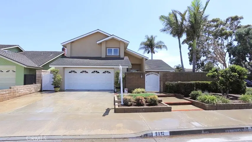 Unleash the gardner in you...so many possibilities with this oversize corner lot and raised planter bed areas.