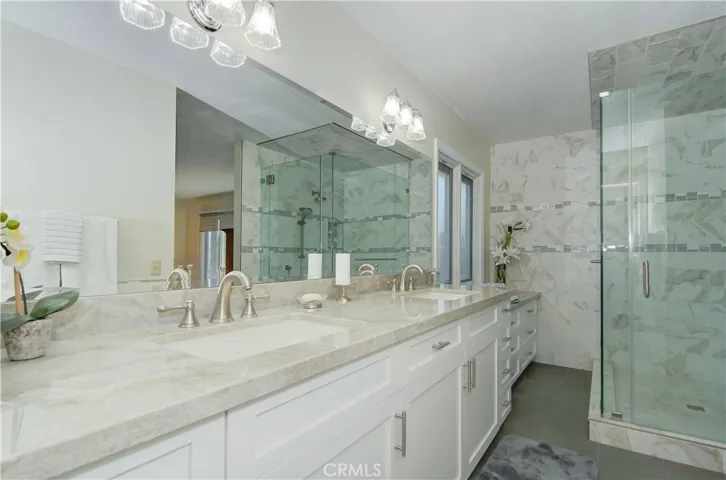 Incredible master bath...dual vanity PLUS extra storage...gorgeous shower with multiple shower heads and tasteful, designer elements.