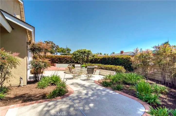 Rear yard wraps around all the way to front entry courtyard...many possibilities here...