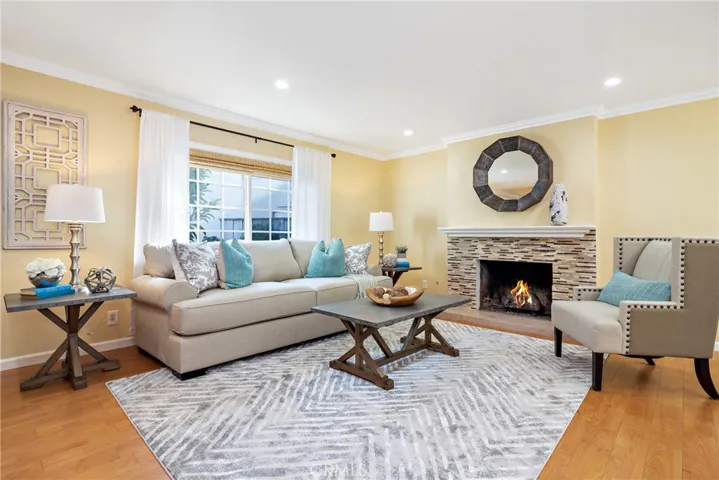Welcome to 5 Paine Cir in desirable neighborhood of Westpark I! Living Room with updated fireplace, recessed lights & crown molding