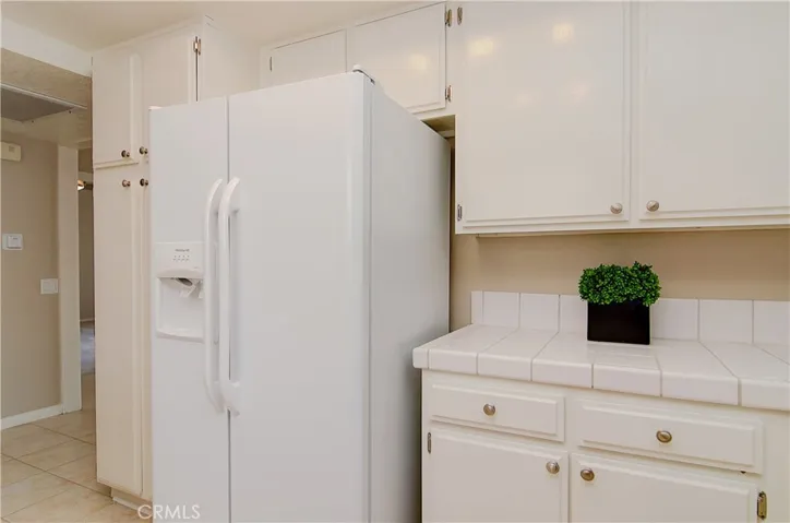 Plenty of room for full size fridge...and love this storage...floor to ceiling pantry too.