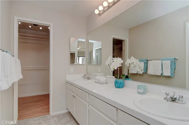Main Master vanity area has lots of couner space, dual sinks, and huge walk-in closet.