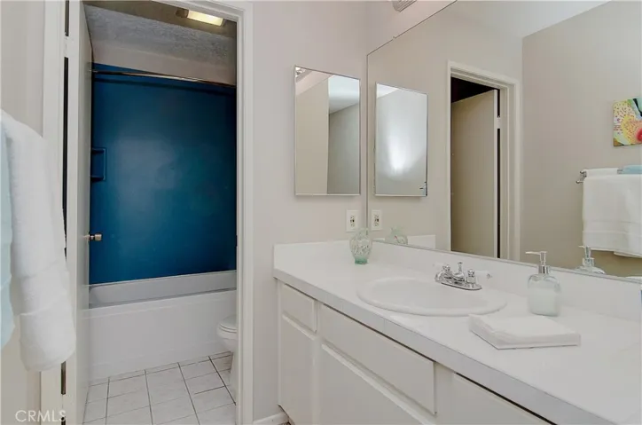Large vanity area, plus separate toilet area with deep soaking tub.