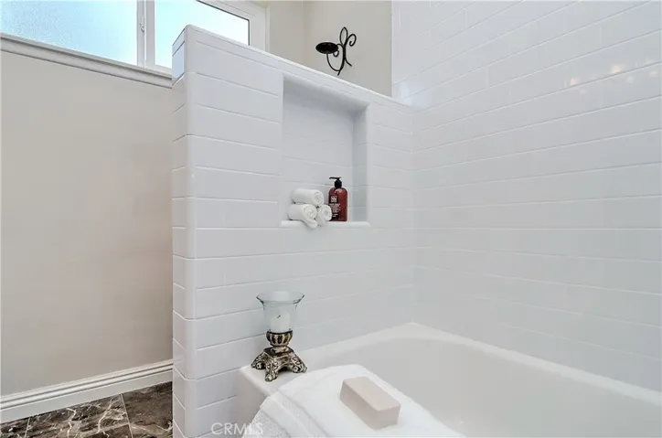 Convenient niche and new subway tile detail here...new bathtub too!