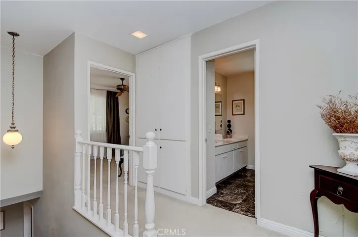 Upstairs foyer makes for easy transition from space to space, and also allows for separation and privacy between rooms.
