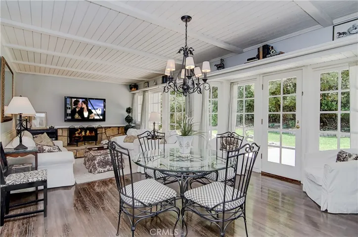 Family area will WOW...with another fireplace, large dining space, bay with French doors and shiplap ceiling.