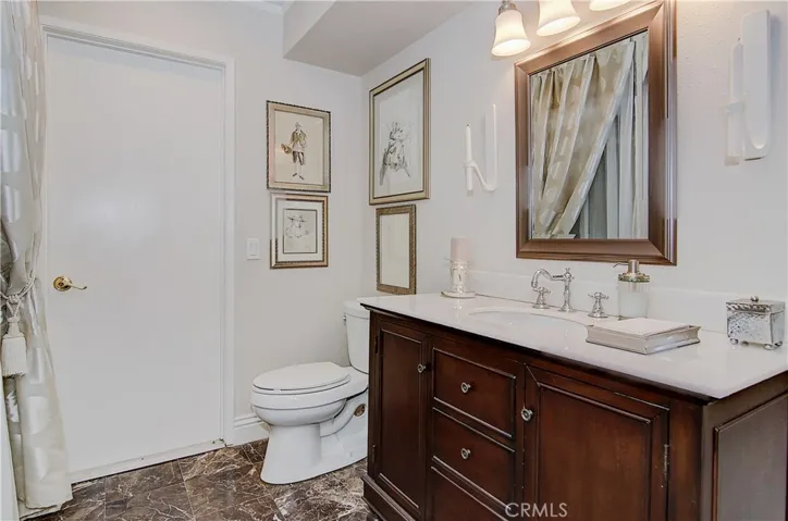 Downstairs 3/4 bath has beautiful vanity and roomy shower.