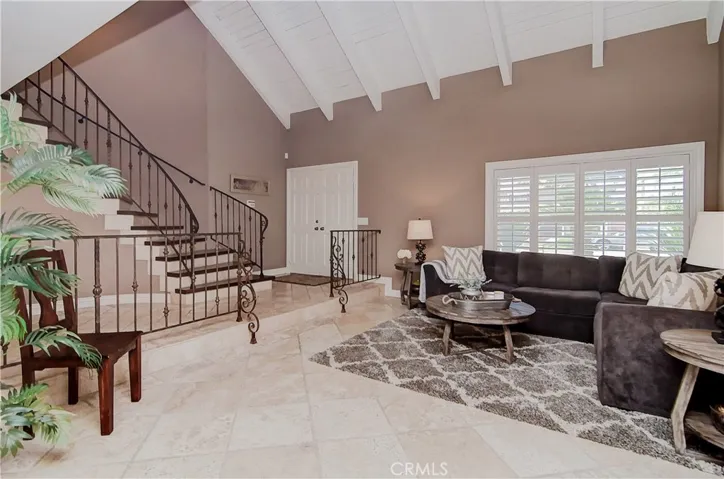Room to roam! Check out the volume and space in the entry and living room...beautiful travertine flooring can be classic or modern...you choose.