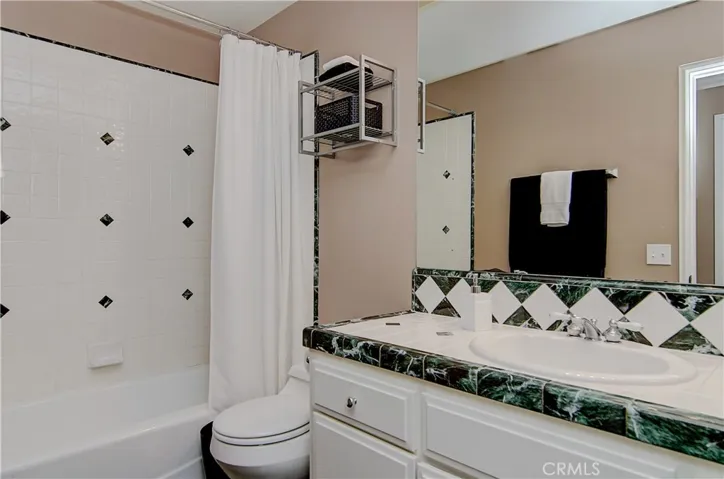 Bright white details in this spacious hall bath upstairs.