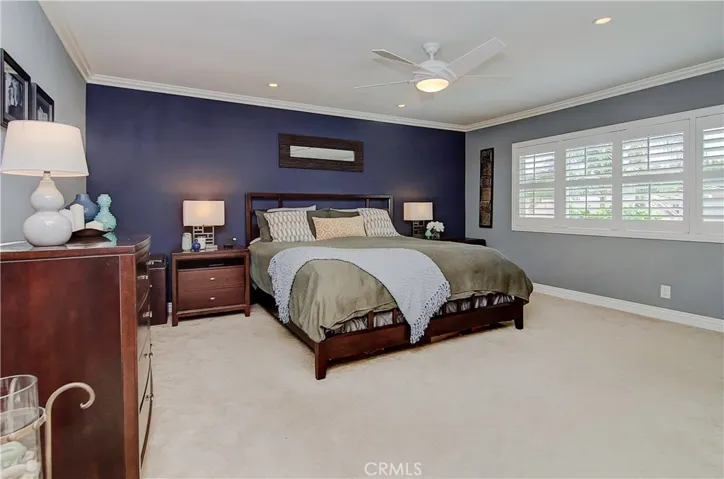 This spacious master suite is the perfect place to land at the end of a busy day...nice upgrades include recessed lighting, plantation shutters and crown molding.