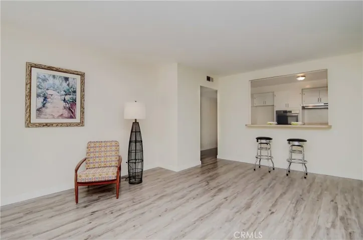 Plenty of room to add a dining table, or even a Grand Piano.. this Great Room Lives LARGE!
