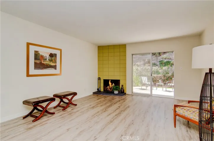 The Mid Century Vibe is Alive with a floor to ceiling Cinder block Fireplace!