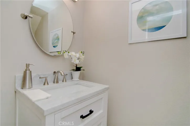 Downstairs half-bath with free-standing vanity