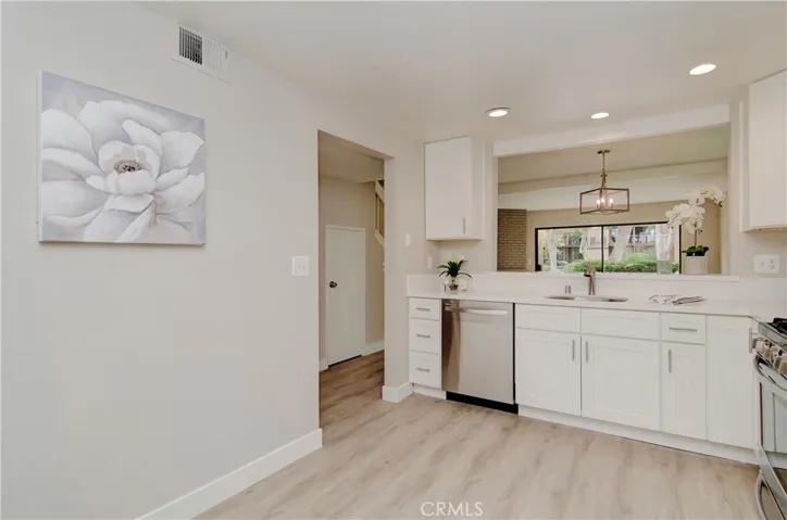 BREAKFAST COUNTER keeps the cook in all the action happening in the living room