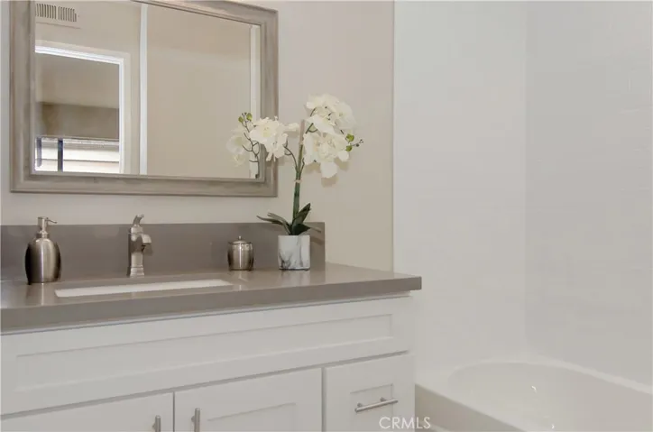  Upgraded 2nd bath with shower/tub, and also a shampoo cubby not seen in this photo.
