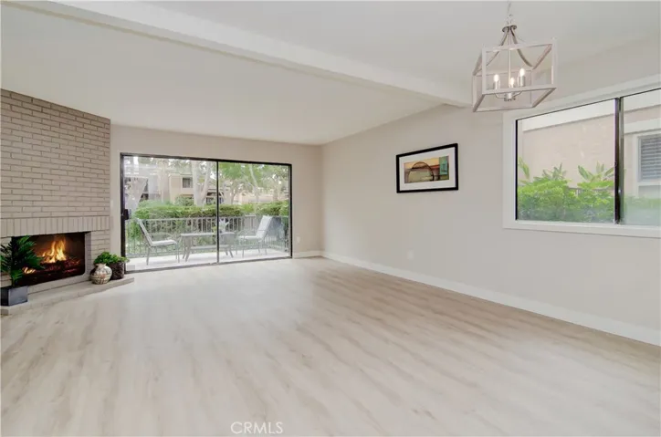 Dining area and living room: Look at the new vinyl plank flooring just absolutely flow.