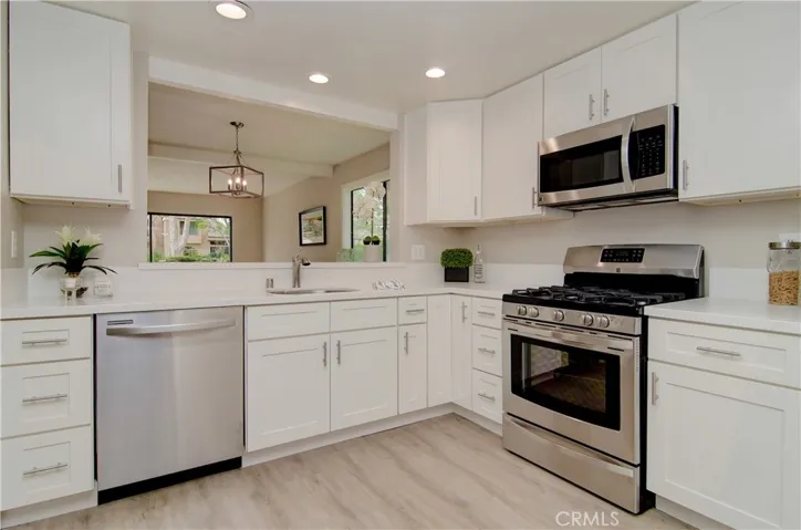 BRAND NEW KITCHEN, BRAND NEW STAINLESS STEEL APPLIANCES, BRAND NEW WHITE SHAKER CABINETS