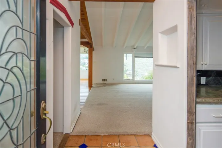 Enter through beveled glass doorway to tiled entry and views from every room beyond.