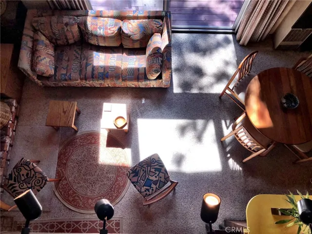 VIEW OF LIVING ROOM FROM LOFT ABOVE