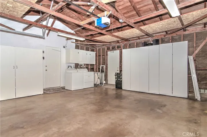We do not usually showcase the garage. BUT when a home is this well cared for, we must show it off.. And look at the Built in Storage and Convenient Laundry Center!