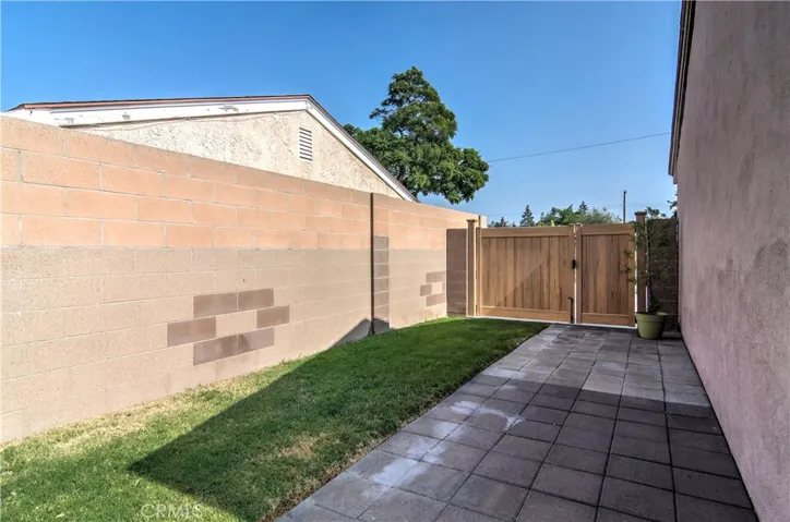 More storage space behind the gates! Also note the Sturdy Block Wall fencing that surrounds the entire rear yard!