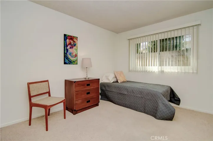 Easy-care vertical blinds keep things consistent in the secondary bedrooms.