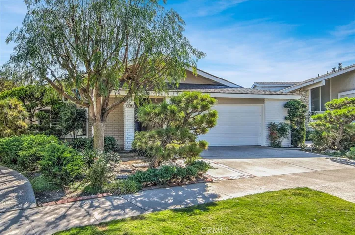 Immaculate curb appeal with freshly pruned trees and newly painted exterior