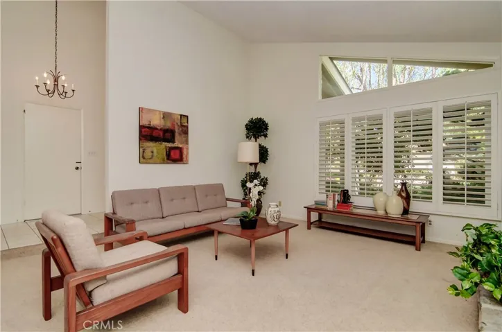 From the grand entry for you'll see the estate size living room with volume ceiling and mid-century details.