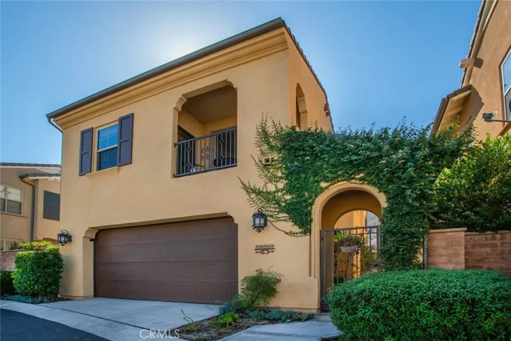 Beautiful front elevation of 28269 Via Del Mar featuring gated entry and two car garage.