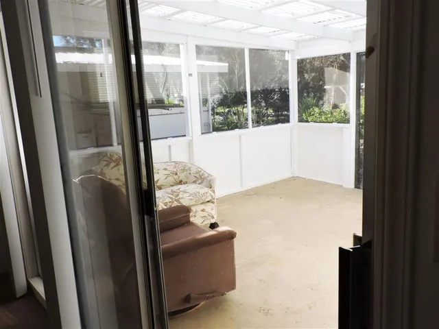 SUNROOM OFF OF THE MASTER BEDROOM.  LOOKING AT THE BACKYARD.