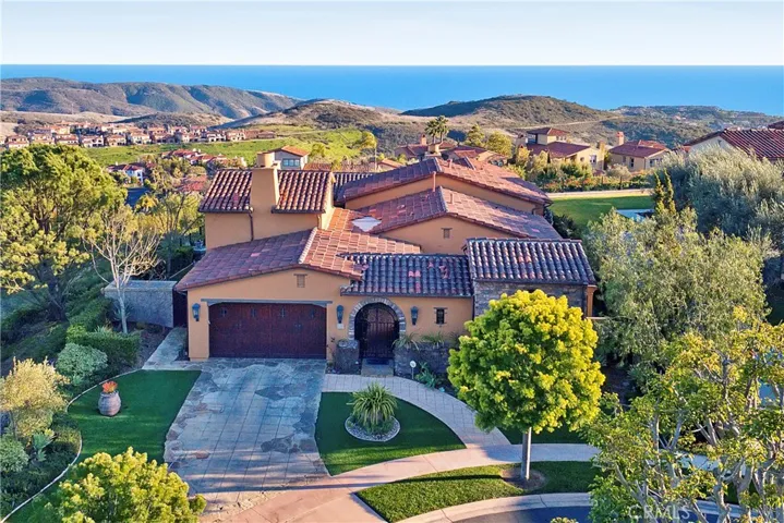 Enjoy coastal breezes from this Tuscan beauty which sits at the end of a quiet cul de sac overlooking The Pacific.