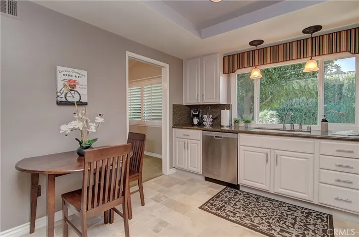 Extra space is perfect for cozy informal dining....could also accommodate an added island for even more storage.