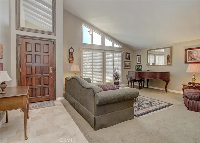 What a great place to greet family and friends...so many nice details including travertine flooring.