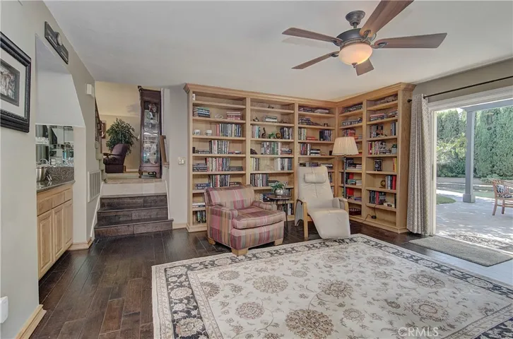 Family room has wet bar area and loads of shelving for a library or is amazing space for all of your prized collections!