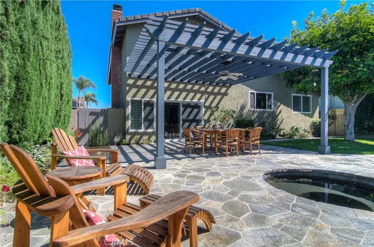 It just keeps getting better!...amazing outdoor spaces are created with stone terrace and stunning arbor.