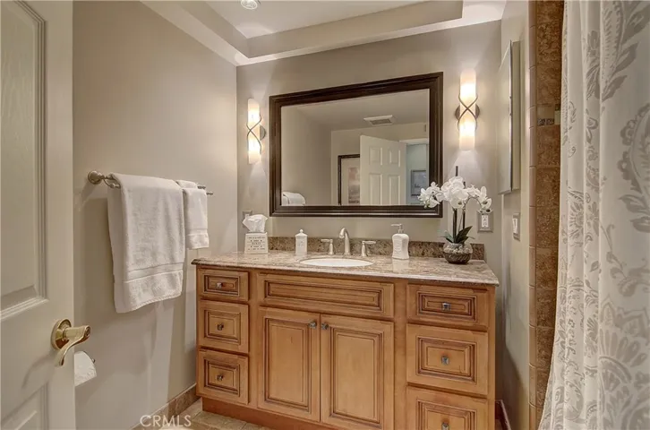Gleaming hall bath has beautiful fixtures and details.