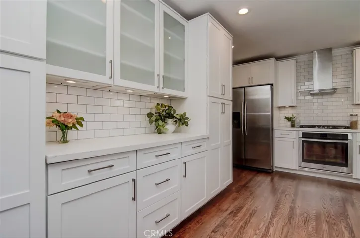 Loads of counter and cabinet space can accommodate several cooks in the kitchen.