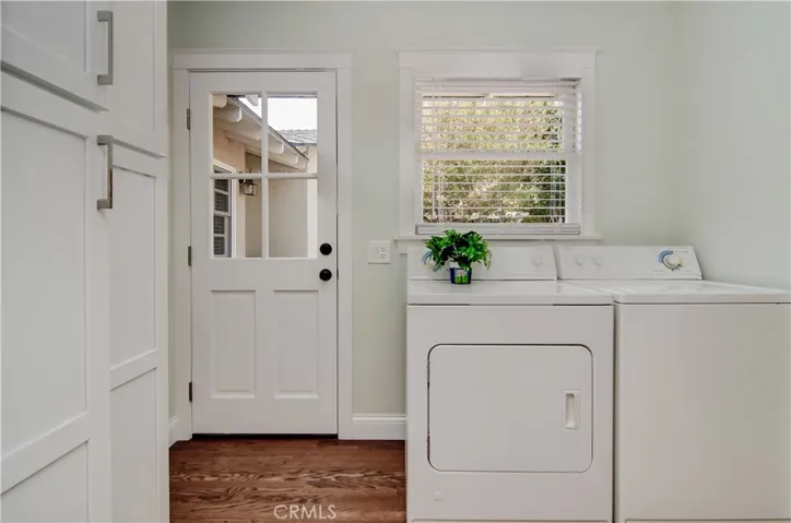 Utility room in main house has great storage and access to rear yard.
