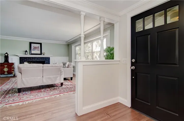 Foyer sets the stage for this immaculate property with pegged hardwood flooring and classic, timeless details.