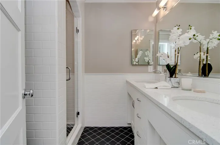 Perfection found in this gorgeous master bath with dual sinks and custom vanity and shower.