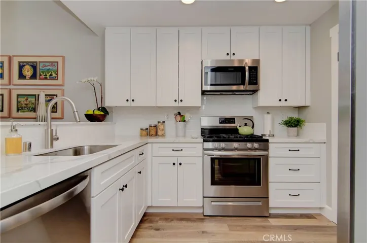 Any chef will love this completely remodeled kitchen with shaker style cabinets, quartz counters, stainless appliances and efficient gas range.
