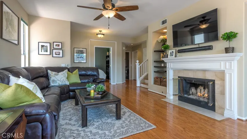 Neutral tones and rich wood floors throughout.