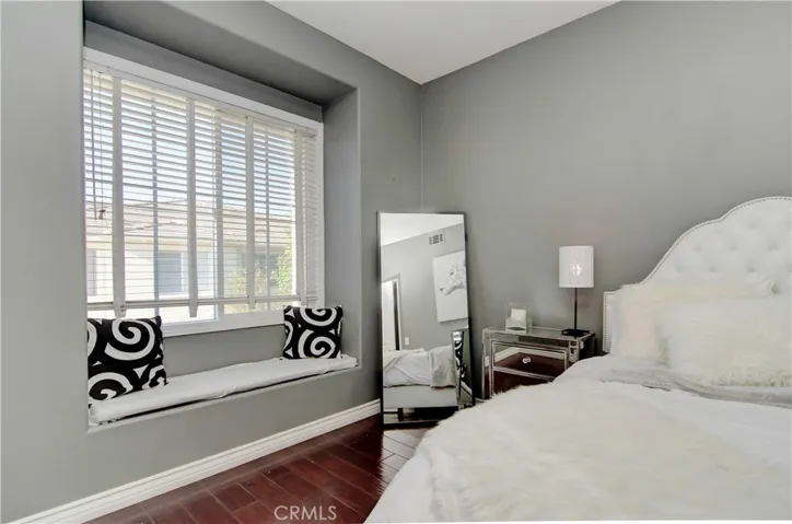 Love this bay window for cozy reading...plus vaulted ceiling adds volume to the space.